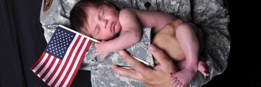 Soldier holding baby in his arms